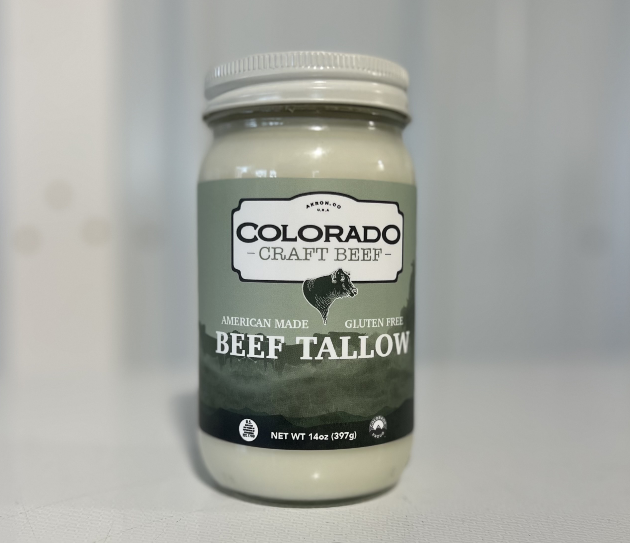 A glass jar of beef tallow